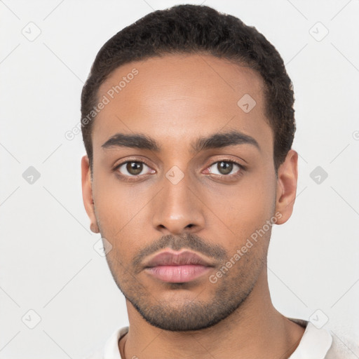 Neutral latino young-adult male with short  black hair and brown eyes