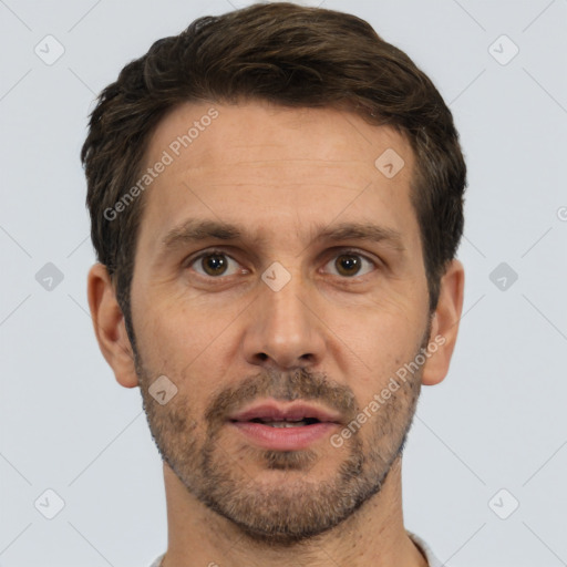 Joyful white adult male with short  brown hair and brown eyes