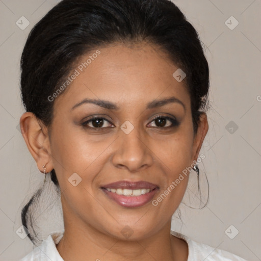 Joyful latino adult female with medium  brown hair and brown eyes