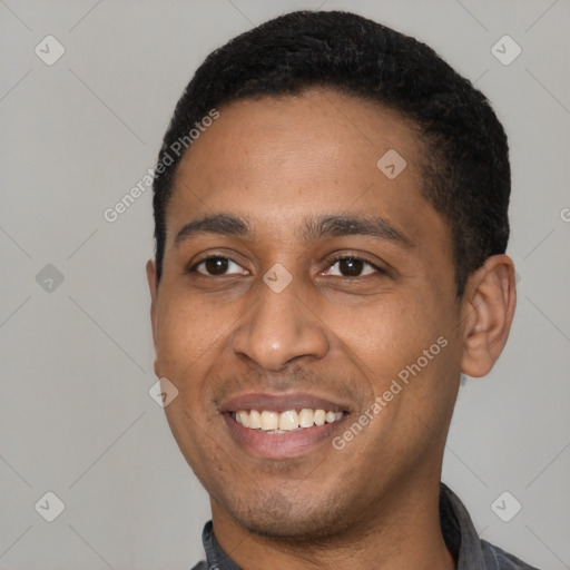 Joyful latino young-adult male with short  black hair and brown eyes