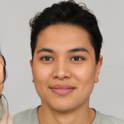 Joyful asian young-adult male with short  brown hair and brown eyes