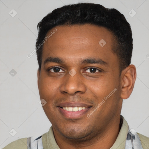 Joyful latino young-adult male with short  black hair and brown eyes