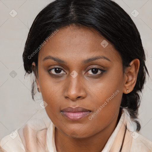 Joyful black young-adult female with medium  brown hair and brown eyes