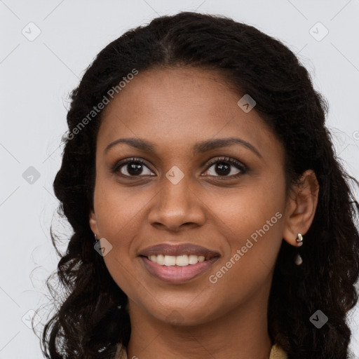 Joyful black young-adult female with long  brown hair and brown eyes