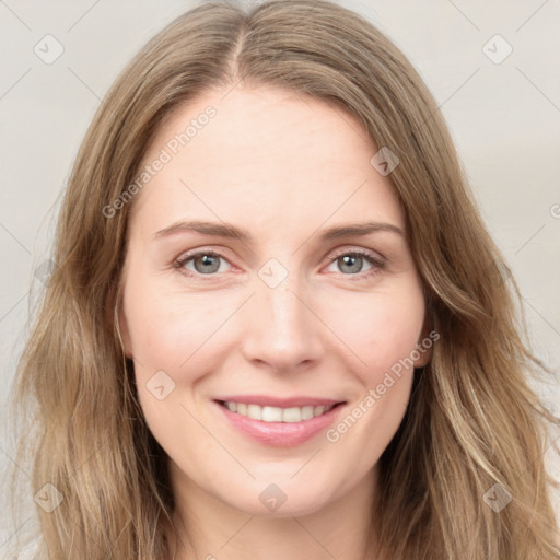 Joyful white young-adult female with long  brown hair and green eyes