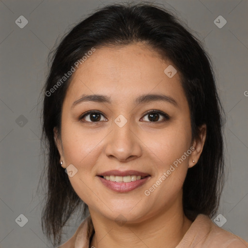 Joyful latino young-adult female with medium  brown hair and brown eyes