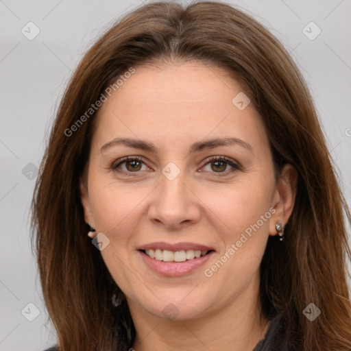 Joyful white adult female with long  brown hair and brown eyes