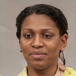 Joyful latino adult female with short  brown hair and brown eyes