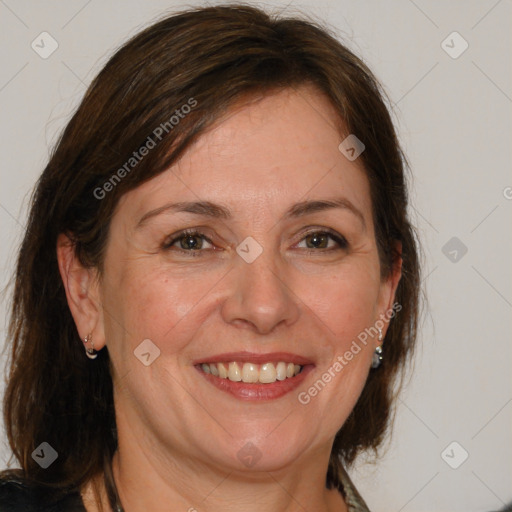 Joyful white adult female with medium  brown hair and brown eyes