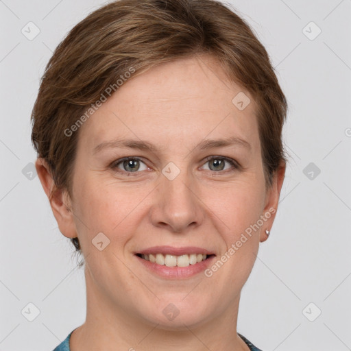 Joyful white young-adult female with short  brown hair and grey eyes