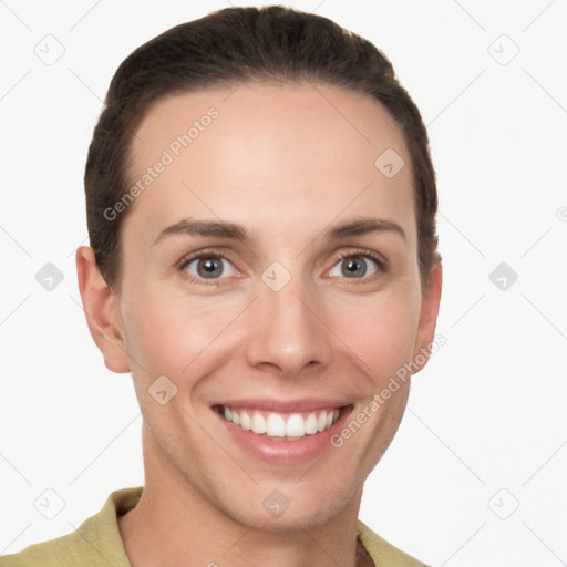 Joyful white young-adult female with short  brown hair and grey eyes