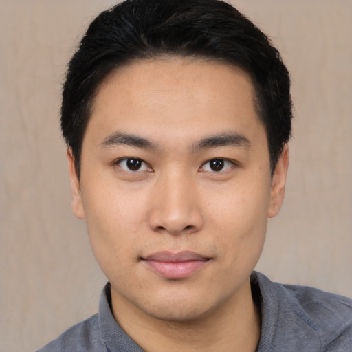 Neutral asian young-adult male with short  black hair and brown eyes