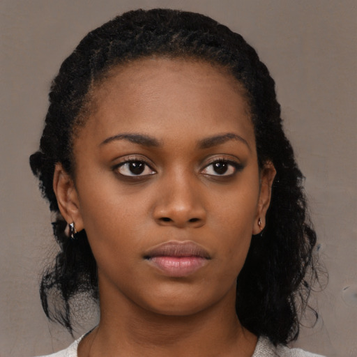 Neutral black young-adult female with long  black hair and brown eyes