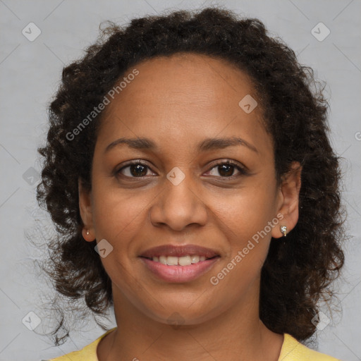 Joyful black young-adult female with medium  brown hair and brown eyes