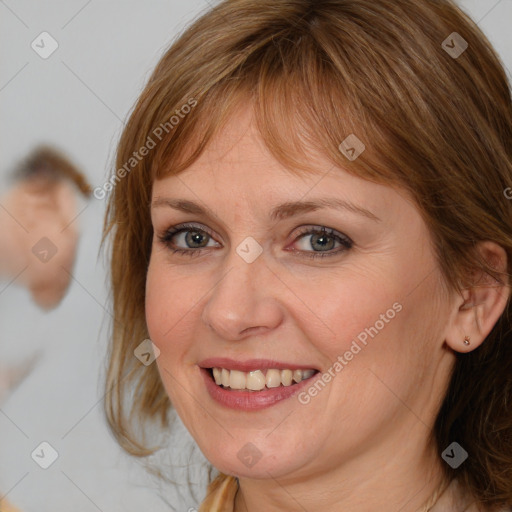 Joyful white young-adult female with medium  brown hair and blue eyes