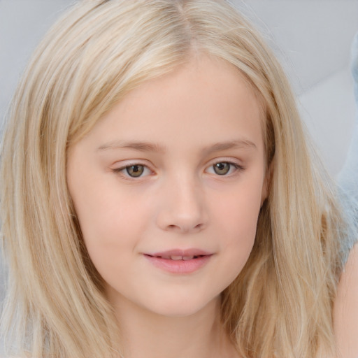 Joyful white child female with long  brown hair and blue eyes