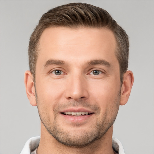 Joyful white young-adult male with short  brown hair and brown eyes