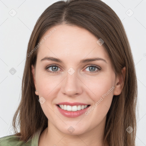 Joyful white young-adult female with long  brown hair and grey eyes