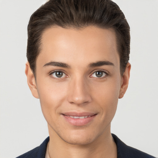 Joyful white young-adult male with short  brown hair and brown eyes