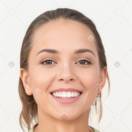 Joyful white young-adult female with medium  brown hair and grey eyes