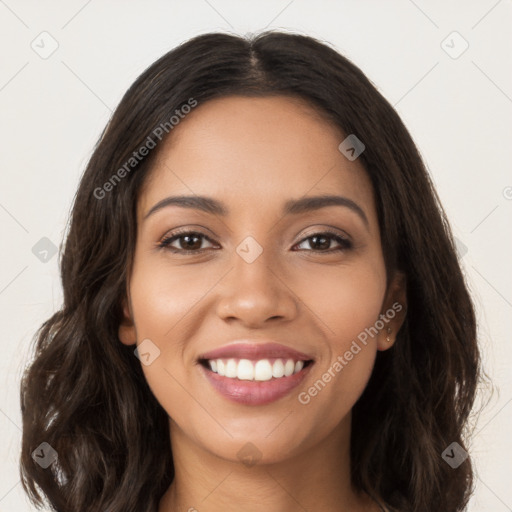 Joyful latino young-adult female with long  brown hair and brown eyes