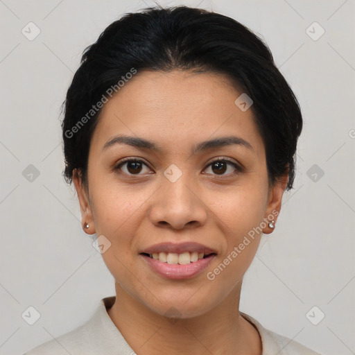 Joyful latino young-adult female with short  brown hair and brown eyes