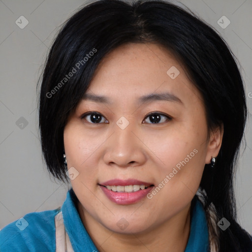 Joyful asian young-adult female with medium  black hair and brown eyes