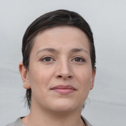 Joyful white young-adult female with medium  brown hair and brown eyes