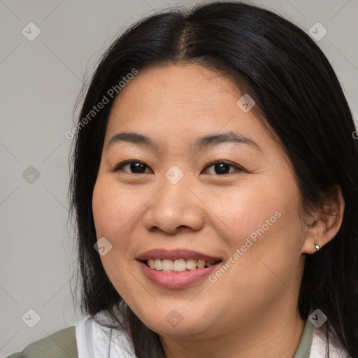 Joyful asian young-adult female with medium  brown hair and brown eyes