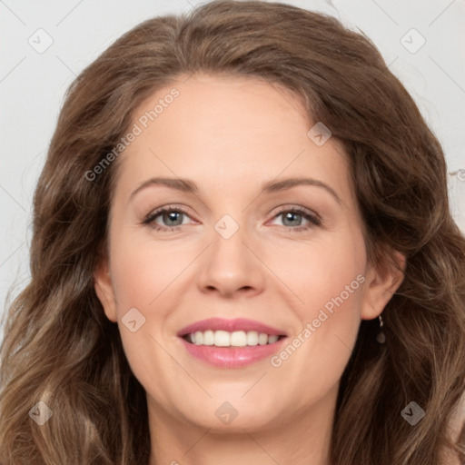 Joyful white young-adult female with long  brown hair and green eyes