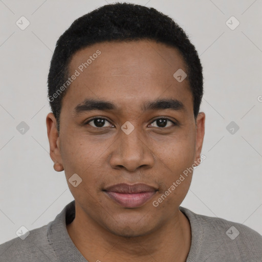 Joyful black young-adult male with short  black hair and brown eyes