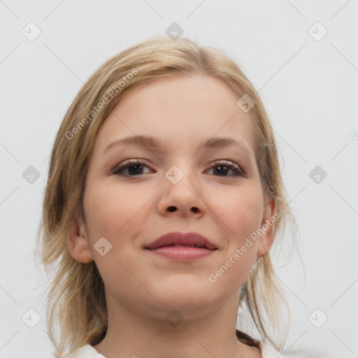 Joyful white young-adult female with medium  brown hair and blue eyes