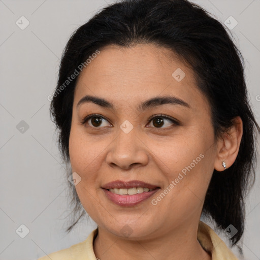 Joyful latino young-adult female with medium  brown hair and brown eyes