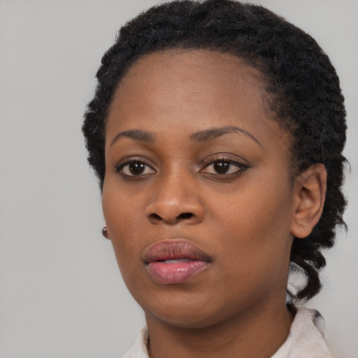 Neutral black young-adult female with short  black hair and brown eyes