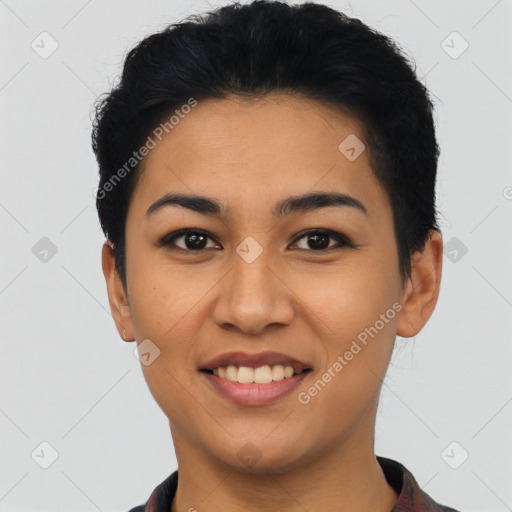 Joyful latino young-adult female with short  black hair and brown eyes