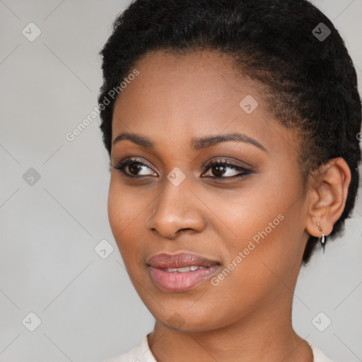 Joyful black young-adult female with short  brown hair and brown eyes