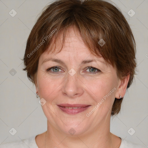 Joyful white adult female with medium  brown hair and grey eyes