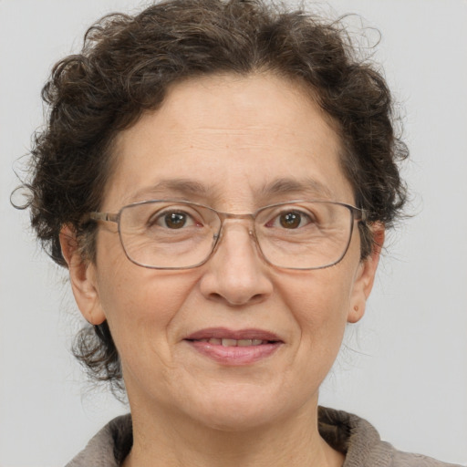 Joyful white middle-aged female with short  brown hair and brown eyes