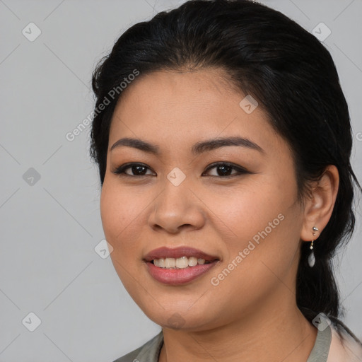 Joyful asian young-adult female with medium  black hair and brown eyes