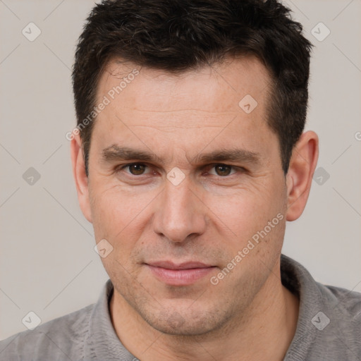 Joyful white adult male with short  brown hair and brown eyes