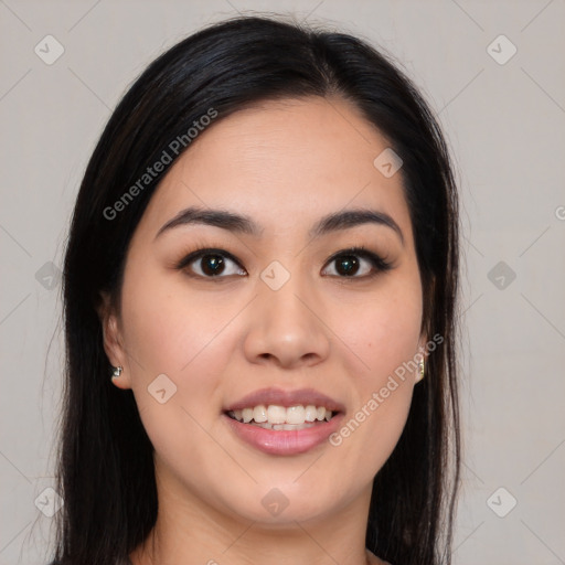 Joyful asian young-adult female with long  brown hair and brown eyes