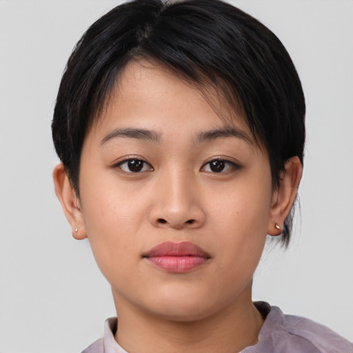 Joyful asian young-adult female with short  brown hair and brown eyes