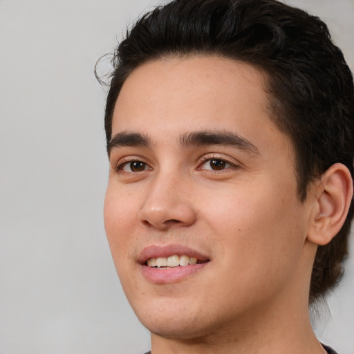 Joyful white young-adult male with medium  brown hair and brown eyes