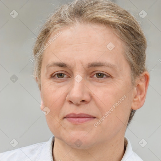 Joyful white adult female with short  brown hair and brown eyes