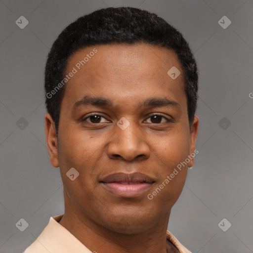 Joyful black young-adult male with short  brown hair and brown eyes