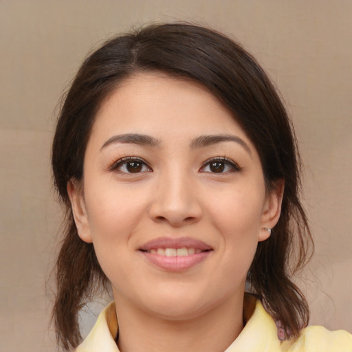 Joyful white young-adult female with medium  brown hair and brown eyes