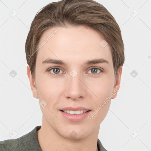 Joyful white young-adult male with short  brown hair and grey eyes