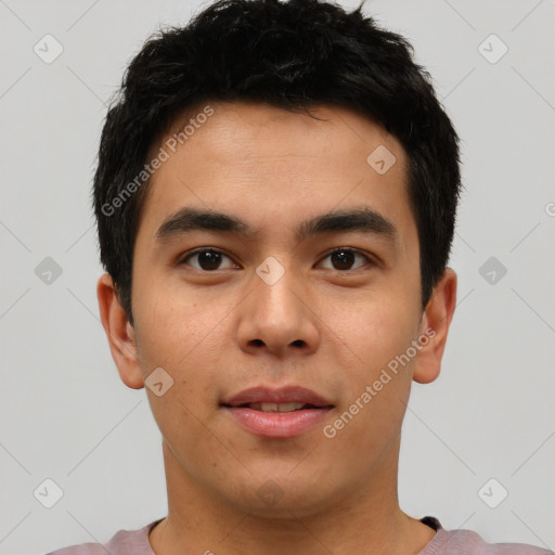 Joyful asian young-adult male with short  brown hair and brown eyes