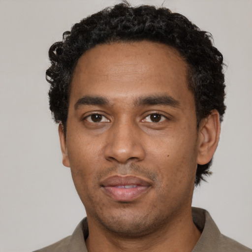 Neutral black young-adult male with short  black hair and brown eyes