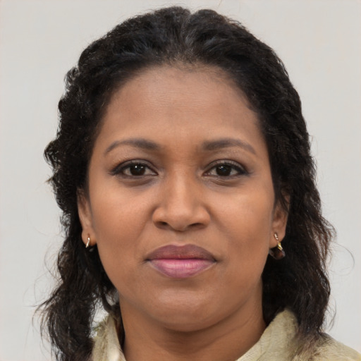 Joyful black young-adult female with medium  brown hair and brown eyes